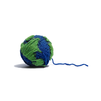 A blue ball of yarn with patches of green yarn; a model of earth.